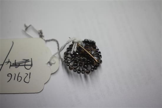 An early 20th century gold and silver, diamond and cultured pearl set openwork circular pendant brooch, 1.25in.